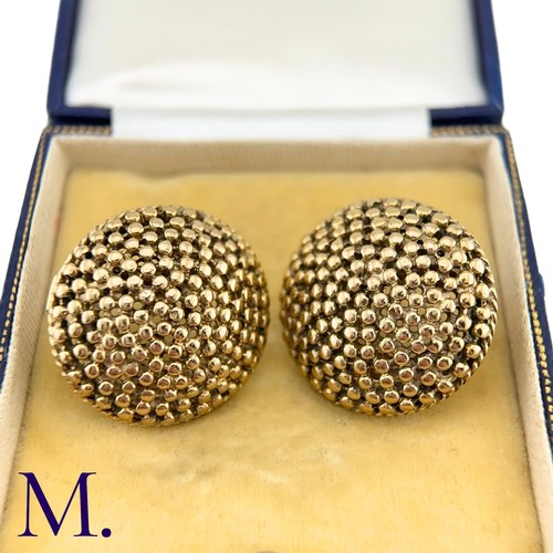 69 - NO RESERVE - A Pair of Large Textured Gold Earrings

The large circular earrings are patterned with ... 