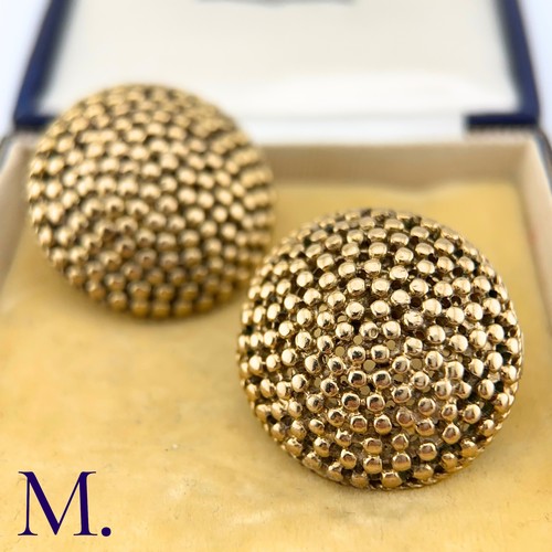 69 - NO RESERVE - A Pair of Large Textured Gold Earrings

The large circular earrings are patterned with ... 