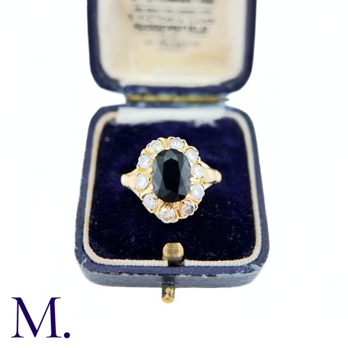 79 - A Sapphire and Diamond Cluster Ring

The 18ct yellow gold ring is set with a 1.6ct oval cut sapphire... 