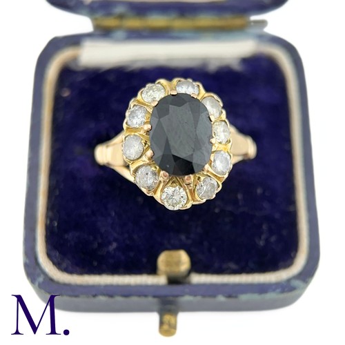 79 - A Sapphire and Diamond Cluster Ring

The 18ct yellow gold ring is set with a 1.6ct oval cut sapphire... 