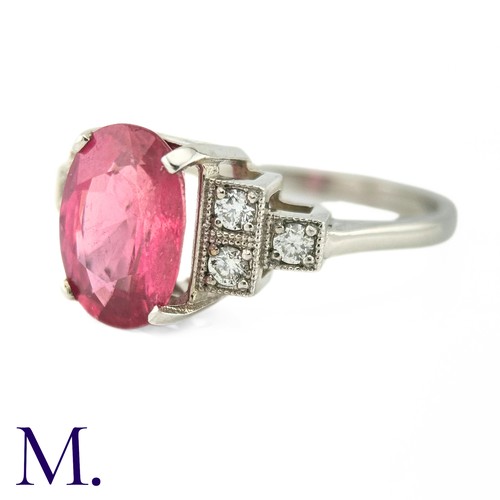 59 - A Ruby and Diamond Ring

The 18ct white gold ring is set with a bright pink ruby of approximately 3.... 