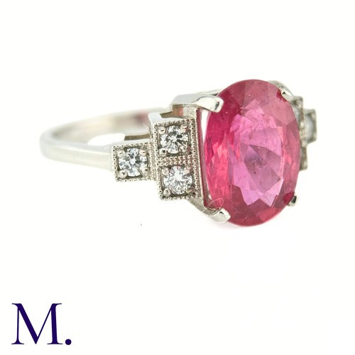 59 - A Ruby and Diamond Ring

The 18ct white gold ring is set with a bright pink ruby of approximately 3.... 