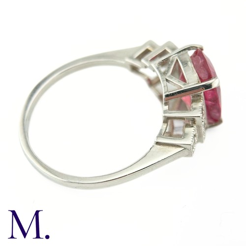 59 - A Ruby and Diamond Ring

The 18ct white gold ring is set with a bright pink ruby of approximately 3.... 