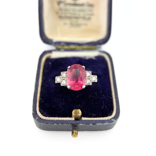 59 - A Ruby and Diamond Ring

The 18ct white gold ring is set with a bright pink ruby of approximately 3.... 