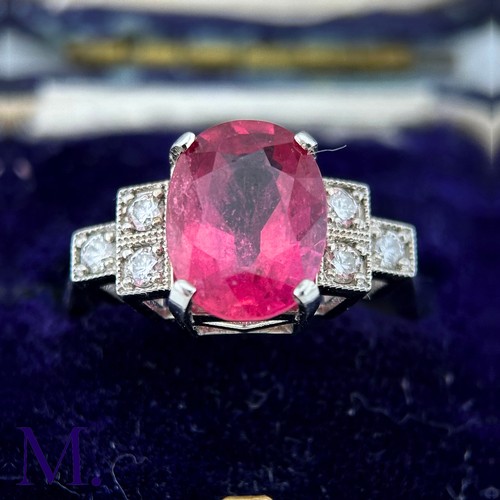 59 - A Ruby and Diamond Ring

The 18ct white gold ring is set with a bright pink ruby of approximately 3.... 