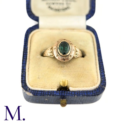 19 - An Antique Green Tourmaline Ring

The gold ring is set with an oval green tourmaline and the band an... 