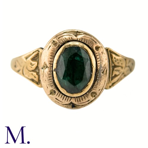 19 - An Antique Green Tourmaline Ring

The gold ring is set with an oval green tourmaline and the band an... 