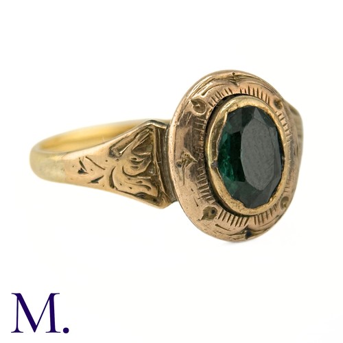 19 - An Antique Green Tourmaline Ring

The gold ring is set with an oval green tourmaline and the band an... 