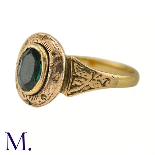 19 - An Antique Green Tourmaline Ring

The gold ring is set with an oval green tourmaline and the band an... 