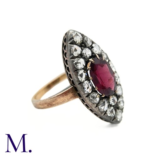 14 - An Antique Garnet and Rose Diamond Marquise Ring

The marquise-shaped ring is set with a deep burgun... 