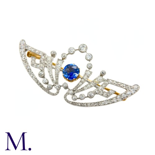 55 - A Belle Epoque Sapphire and Diamond Brooch
The brooch is set with a round cut sapphire of approximat... 