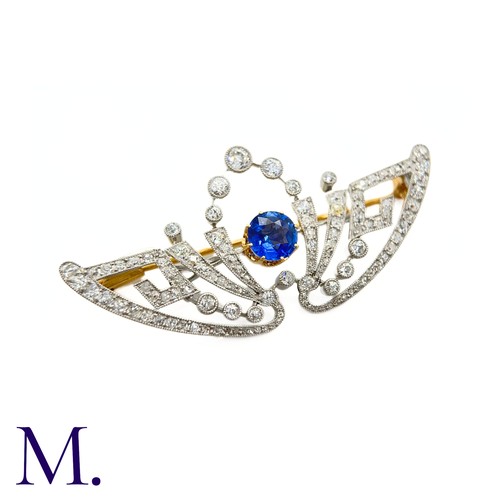 55 - A Belle Epoque Sapphire and Diamond Brooch
The brooch is set with a round cut sapphire of approximat... 