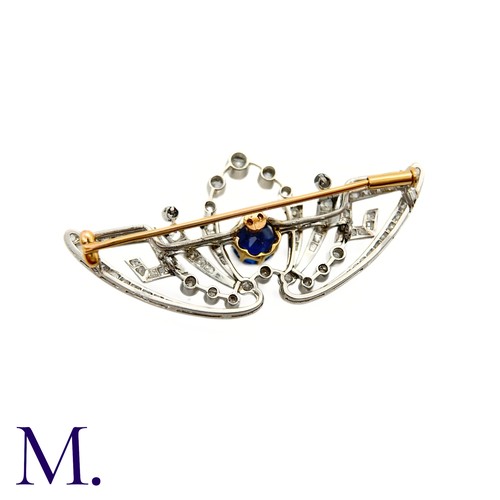 55 - A Belle Epoque Sapphire and Diamond Brooch
The brooch is set with a round cut sapphire of approximat... 