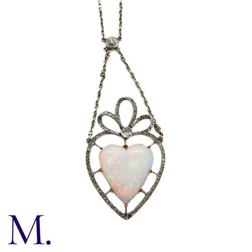 120 - An Antique Opal Heart and Diamond Necklace

The fine 18ct white gold necklace suspends a fine heart-... 