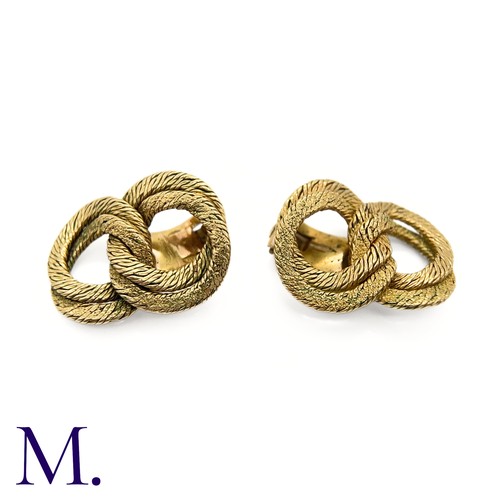 110 - A Pair of Gold Earclips by Georges Lenfant

The 18ct yellow gold woven earclips are by French goldsm... 