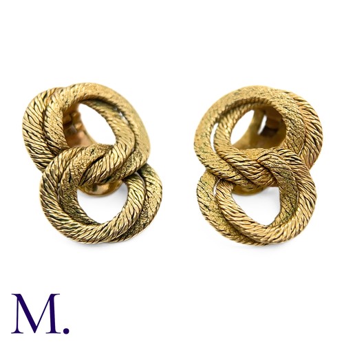 110 - A Pair of Gold Earclips by Georges Lenfant

The 18ct yellow gold woven earclips are by French goldsm... 