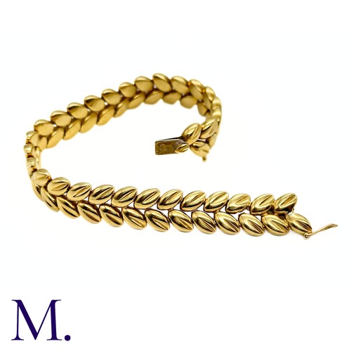 109 - A Gold Bracelet by Boucheron

The 18ct yellow gold bracelet with foliate form is by Boucheron Paris ... 