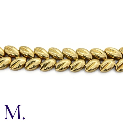 109 - A Gold Bracelet by Boucheron

The 18ct yellow gold bracelet with foliate form is by Boucheron Paris ... 