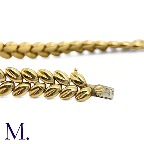 109 - A Gold Bracelet by Boucheron

The 18ct yellow gold bracelet with foliate form is by Boucheron Paris ... 