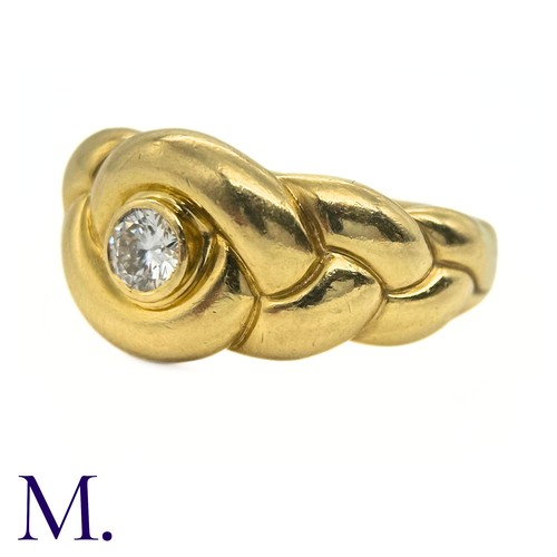 99 - A Diamond Ring by Van Cleef & Arpels

The 18ct yellow gold knot-form ring by Van Cleef and Arpels is... 