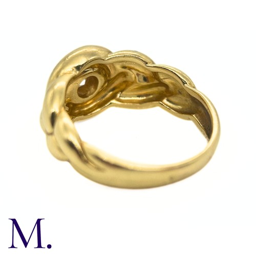 99 - A Diamond Ring by Van Cleef & Arpels

The 18ct yellow gold knot-form ring by Van Cleef and Arpels is... 