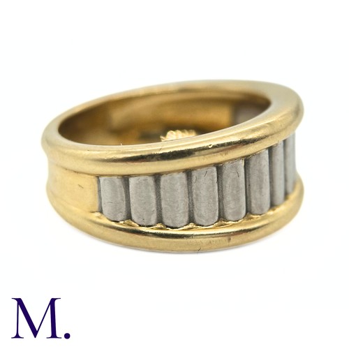 96 - A Two-Colour Gold Ring by Cartier

The two-colour fluted gold ring is by Cartier Paris.  The band is... 