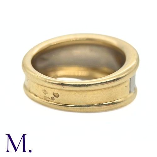 96 - A Two-Colour Gold Ring by Cartier

The two-colour fluted gold ring is by Cartier Paris.  The band is... 