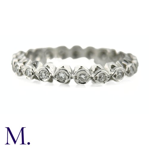 56 - A Diamond Eternity Band

The 18ct white gold band is set with approximately 0.65ct of round cut diam... 