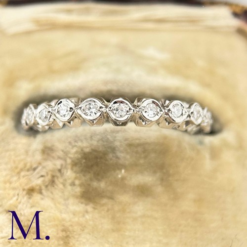 56 - A Diamond Eternity Band

The 18ct white gold band is set with approximately 0.65ct of round cut diam... 