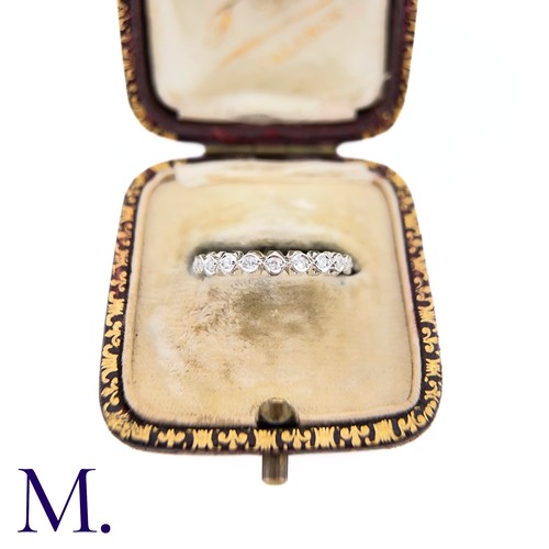 56 - A Diamond Eternity Band

The 18ct white gold band is set with approximately 0.65ct of round cut diam... 