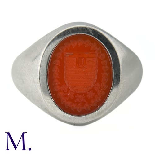 58 - A Platinum and Carnelian Signet Ring

The platinum ring is set with a carved oval-shaped carnelian d... 