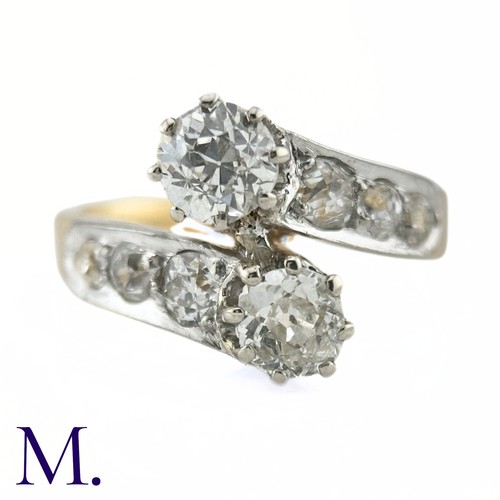 37 - A Diamond Cross-Over Ring

The 18ct gold ring is set with two old cut diamonds of approximately 0.50... 