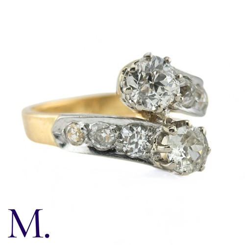 37 - A Diamond Cross-Over Ring

The 18ct gold ring is set with two old cut diamonds of approximately 0.50... 