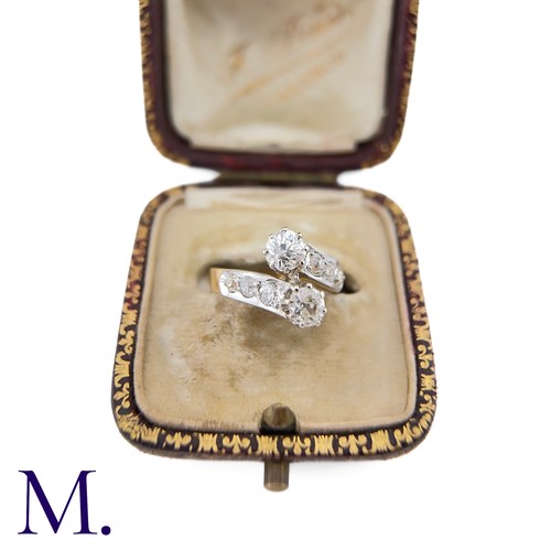 37 - A Diamond Cross-Over Ring

The 18ct gold ring is set with two old cut diamonds of approximately 0.50... 