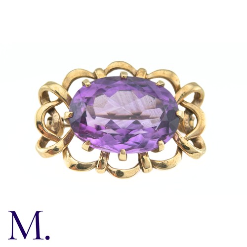 89 - An Amethyst Brooch

The 9ct yellow gold brooch is set with a large (approx. 11.4ct) well-saturated a... 