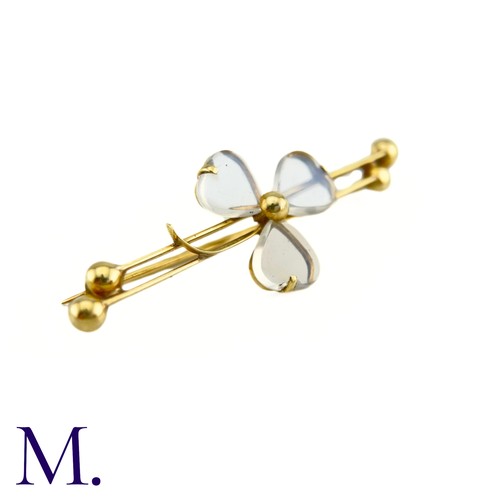 70 - An Antique Moonstone Shamrock Brooch

The 9ct yellow gold bar brooch is set with moonstones in a tre... 