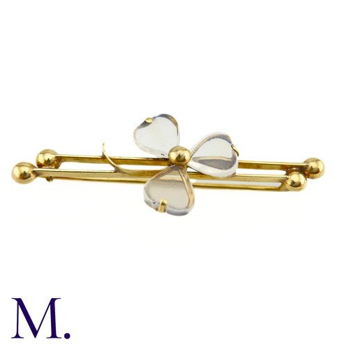 70 - An Antique Moonstone Shamrock Brooch

The 9ct yellow gold bar brooch is set with moonstones in a tre... 