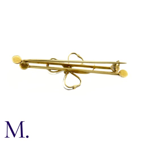 70 - An Antique Moonstone Shamrock Brooch

The 9ct yellow gold bar brooch is set with moonstones in a tre... 