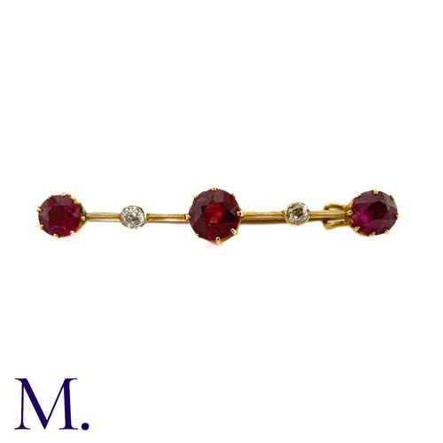 87 - An Antique Garnet and Diamond Bar Brooch

This 9ct yellow gold brooch is set with three deep purple-... 