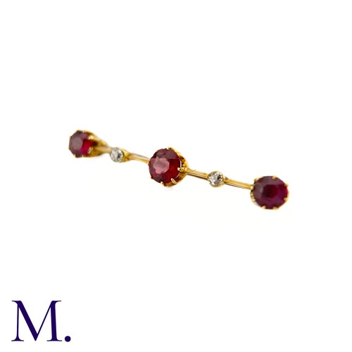 87 - An Antique Garnet and Diamond Bar Brooch

This 9ct yellow gold brooch is set with three deep purple-... 