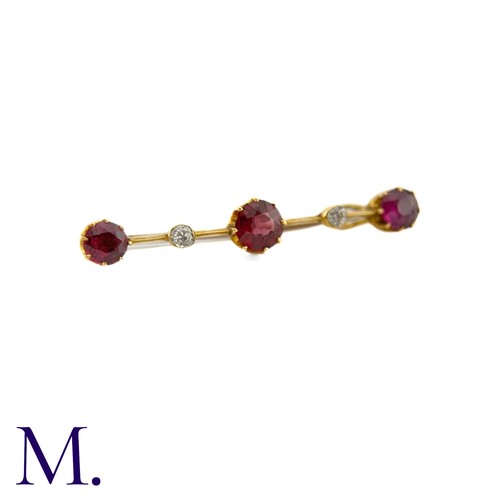 87 - An Antique Garnet and Diamond Bar Brooch

This 9ct yellow gold brooch is set with three deep purple-... 