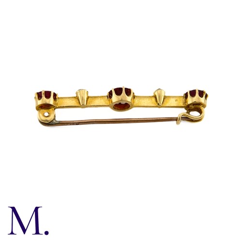 87 - An Antique Garnet and Diamond Bar Brooch

This 9ct yellow gold brooch is set with three deep purple-... 