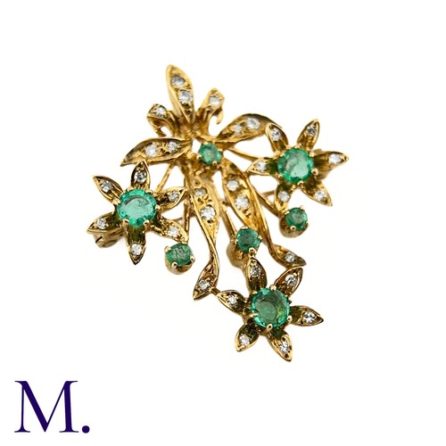 85 - An Emerald and Diamond Pendant Brooch

The 9ct yellow gold brooch is set with round cut emeralds and... 