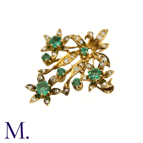 85 - An Emerald and Diamond Pendant Brooch

The 9ct yellow gold brooch is set with round cut emeralds and... 