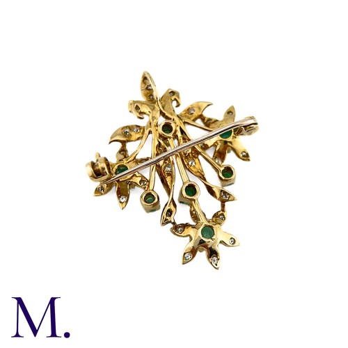 85 - An Emerald and Diamond Pendant Brooch

The 9ct yellow gold brooch is set with round cut emeralds and... 