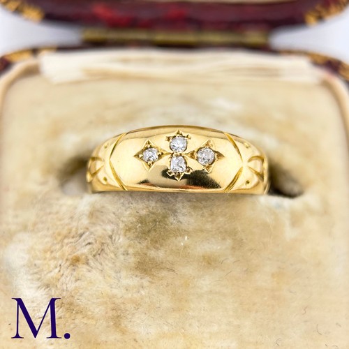 32 - An Antique Diamond Gypsy Ring

The antique 18ct yellow gold ring is set with four small diamonds.

W... 