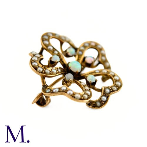 117 - An Opal and Pearl Brooch

The floral patterned openwork brooch in 9ct yellow gold is set with good c... 