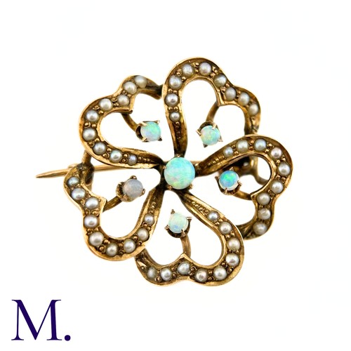 117 - An Opal and Pearl Brooch

The floral patterned openwork brooch in 9ct yellow gold is set with good c... 