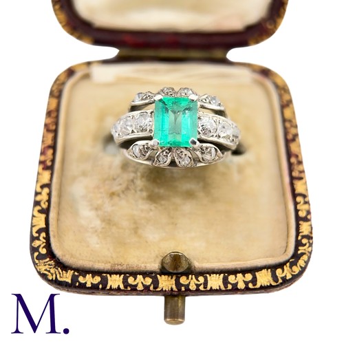 60 - An Emerald and Diamond Ring
The 18ct white gold ring is set with a bright green emerald cut emerald ... 