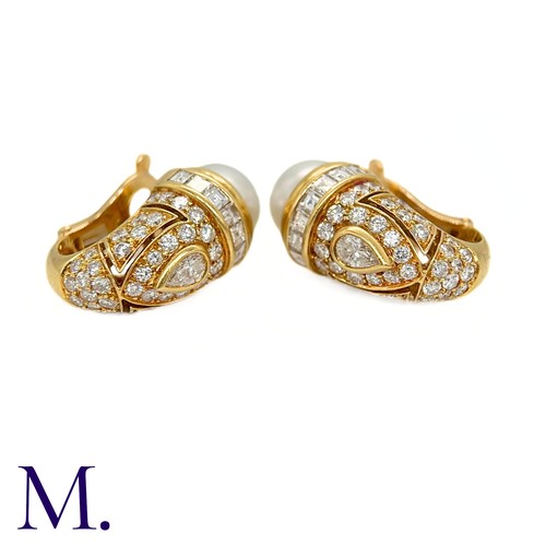 111 - A Pair of Pearl and Diamond Earclips by Bulgari

The 18ct yellow gold earclips are by Bulgari.  Each... 